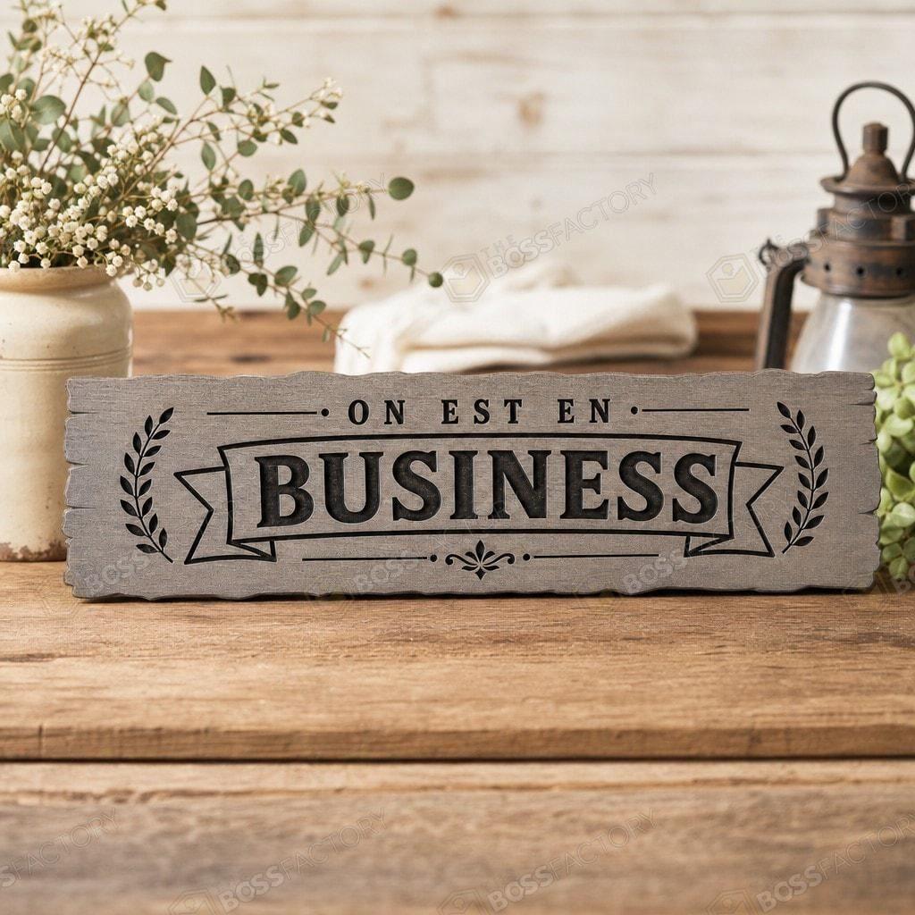 Custom laser-engraved office sign staged on a shelf